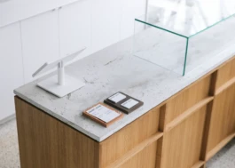 Detail of the bespoke oak and concrete display counter at Saint-Jean Bakery in Amsterdam by IJarchitecture. 