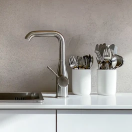 Back counter detail with stainless steel tap and clay plaster wall at Saint-Jean Bakery in Amsterdam by IJarchitecture. 